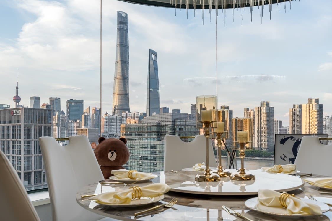 Floor-to-ceiling windows with panoramic river views