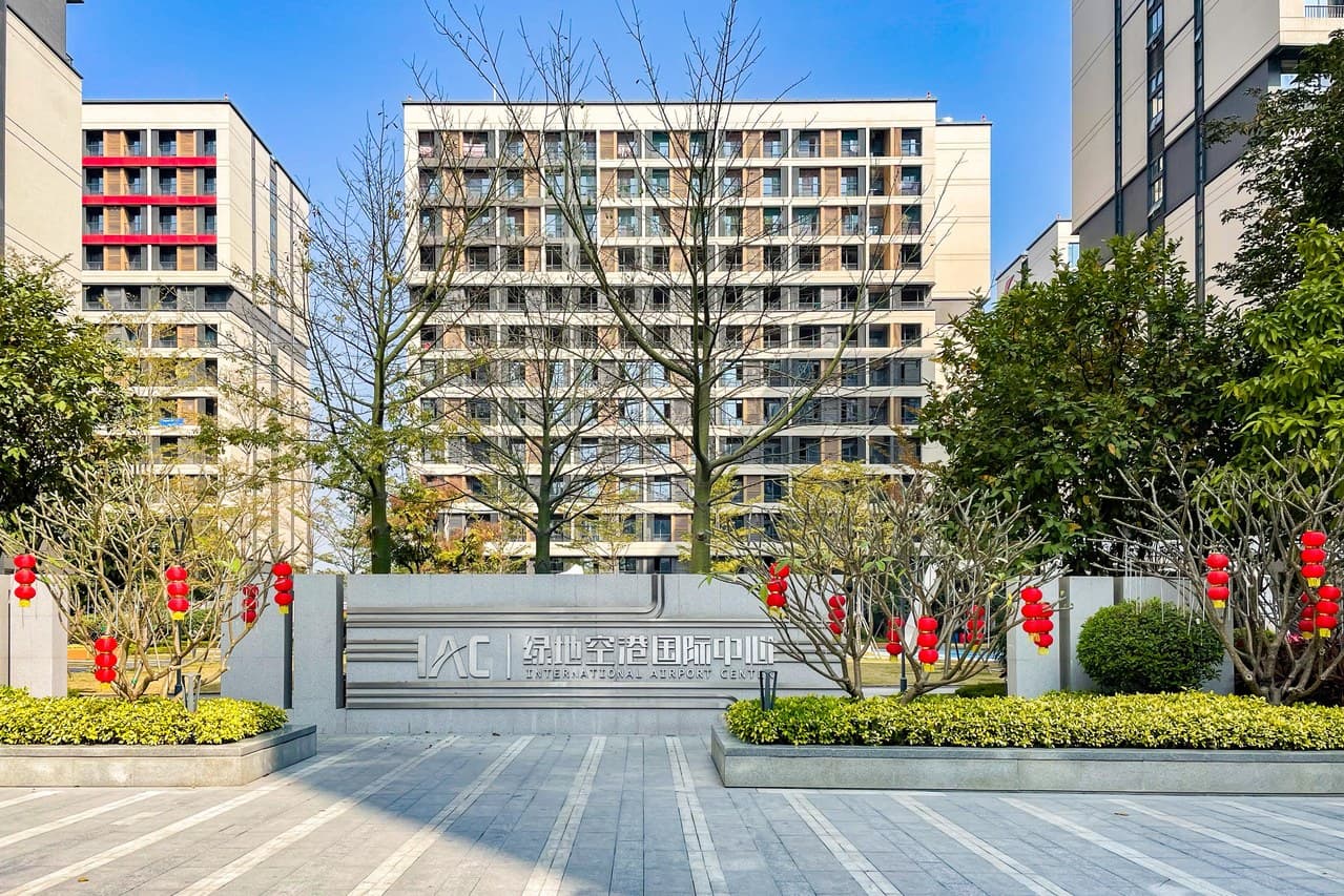 Garden-style residential complex with balconies and elevators