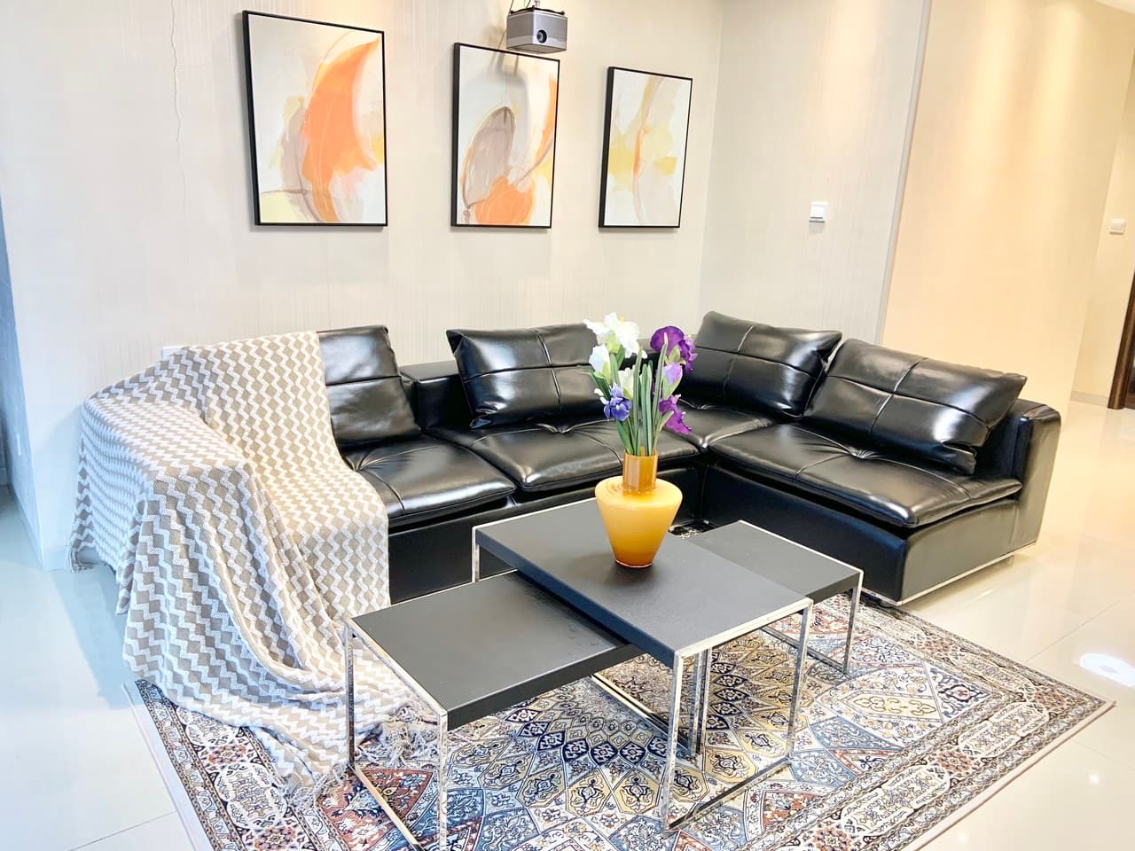The living room features floor-to-ceiling windows offering a 270-degree view of the Canton Tower.