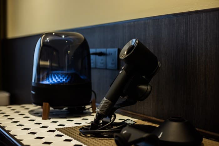 Dyson hair dryer, Harman Kardon speakers
