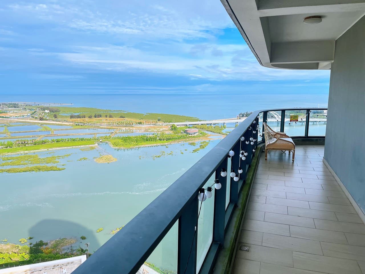 A circular balcony offers unobstructed views of the sea.