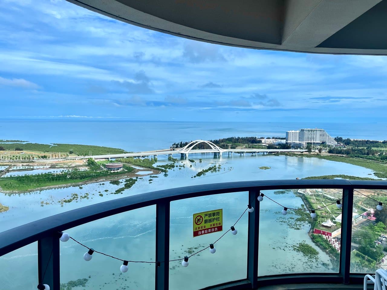 A circular balcony offers unobstructed views of the sea.