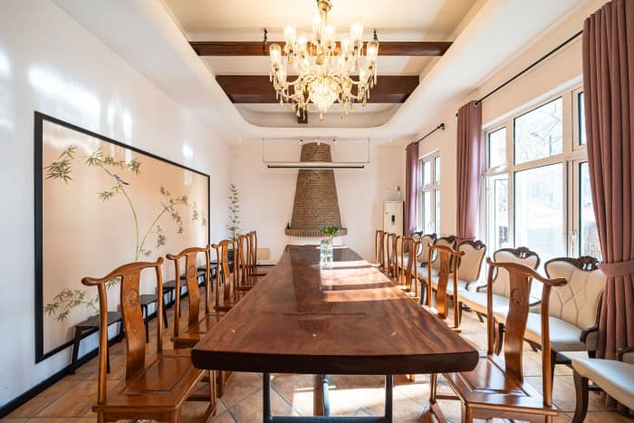 The meeting room, located on the first floor, can accommodate 15-20 people.