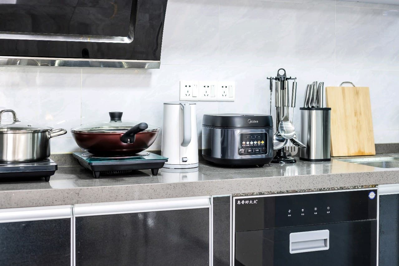 The kitchen is equipped with cooking utensils, including pots, pans, and dishes.