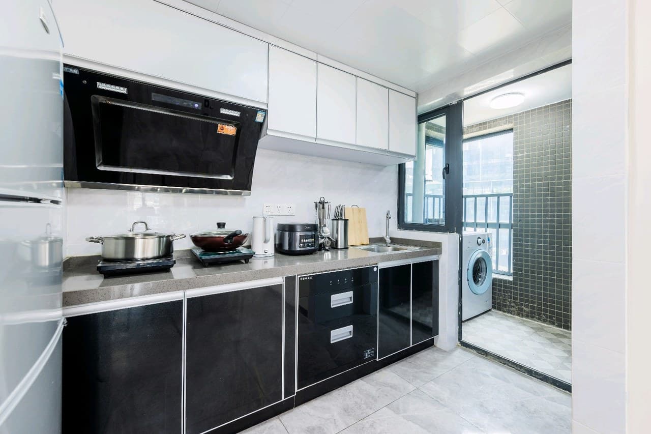 The kitchen is equipped with cooking utensils, including pots, pans, and dishes.