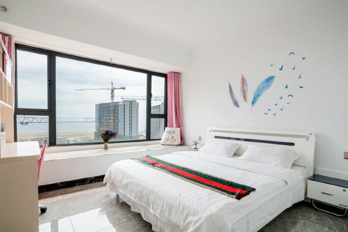 The master bedroom has a large bay window where you can sit and look out at the sea.